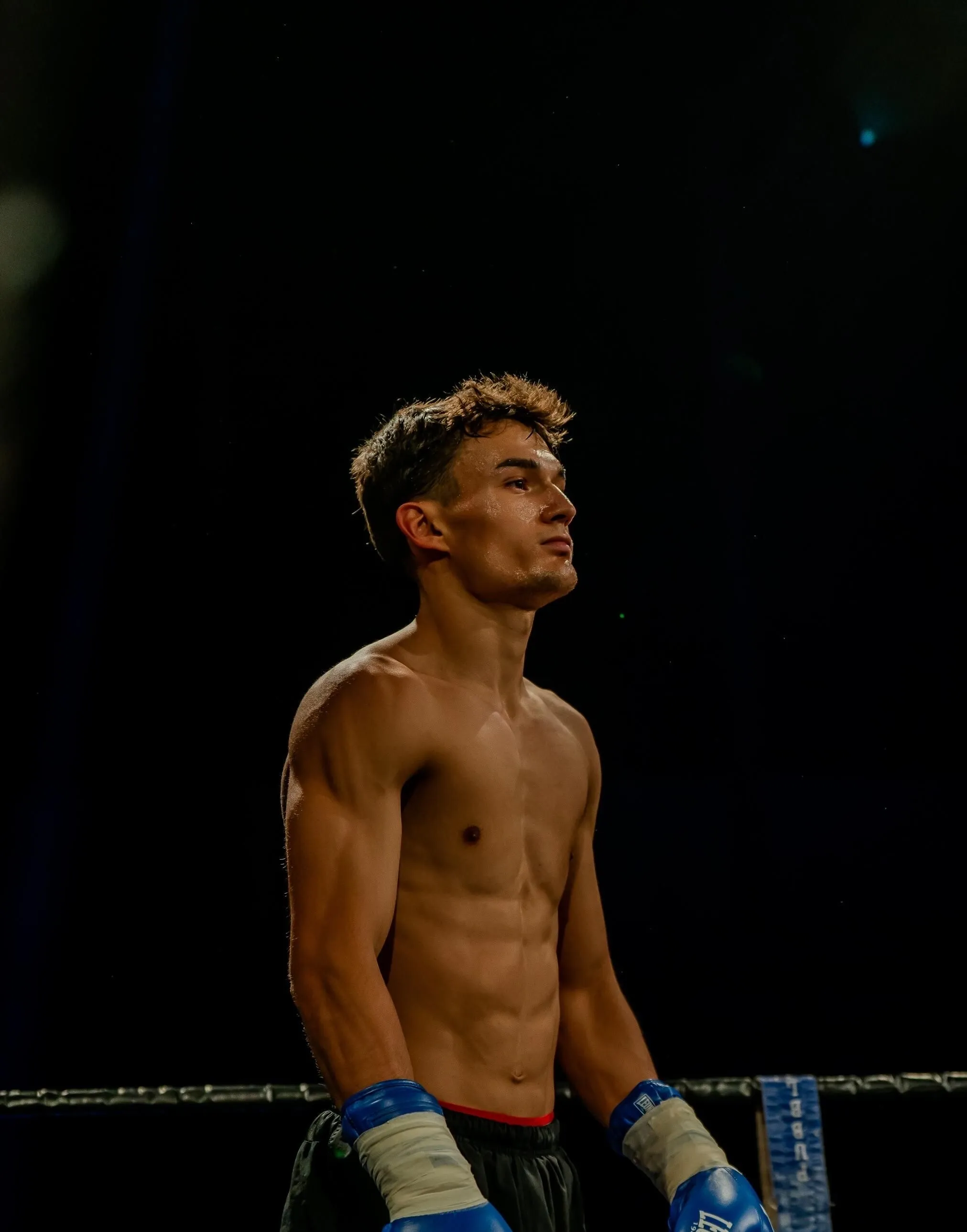 Anto in the ring corner looking up before a fight