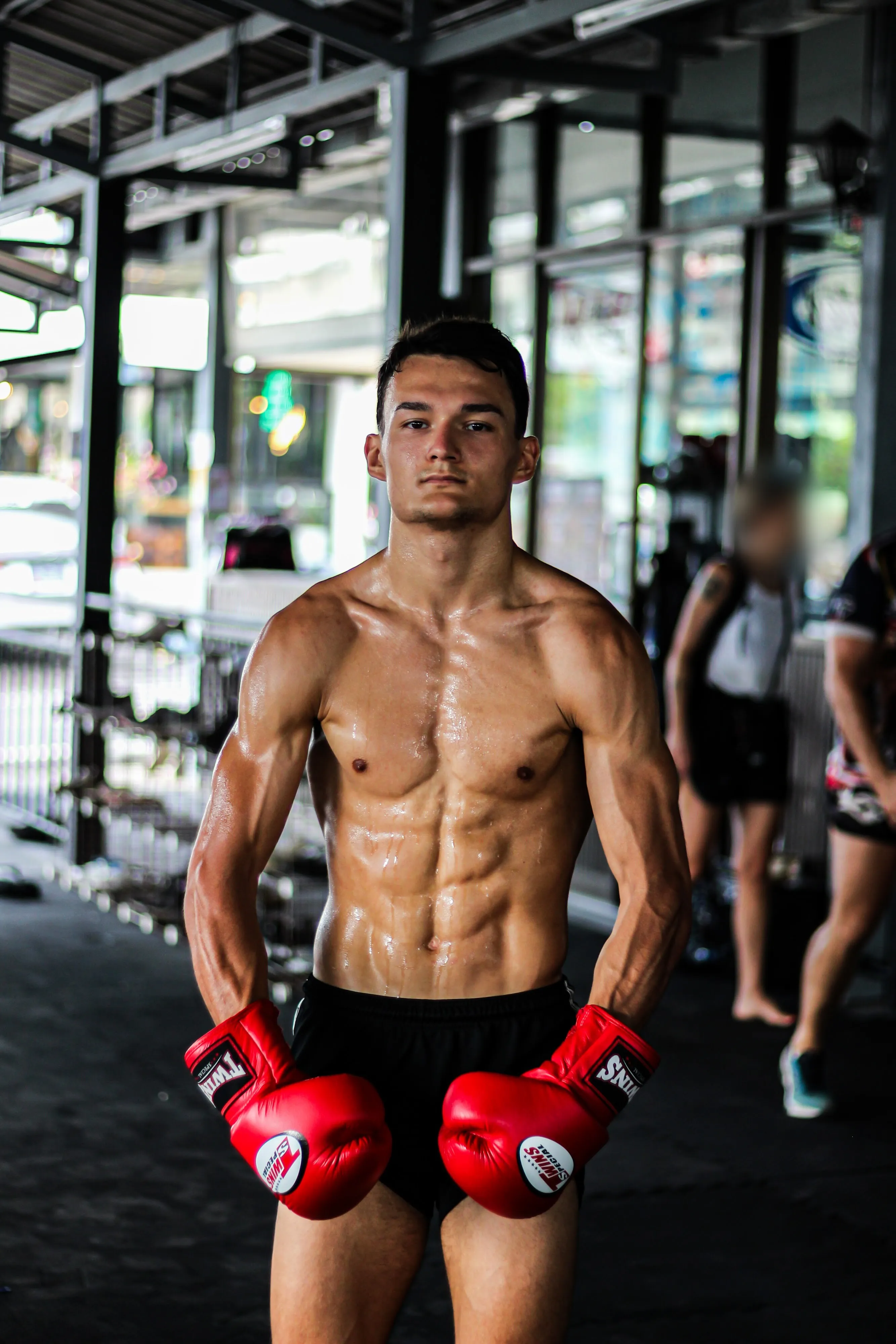 Anto standing in a Thai gym