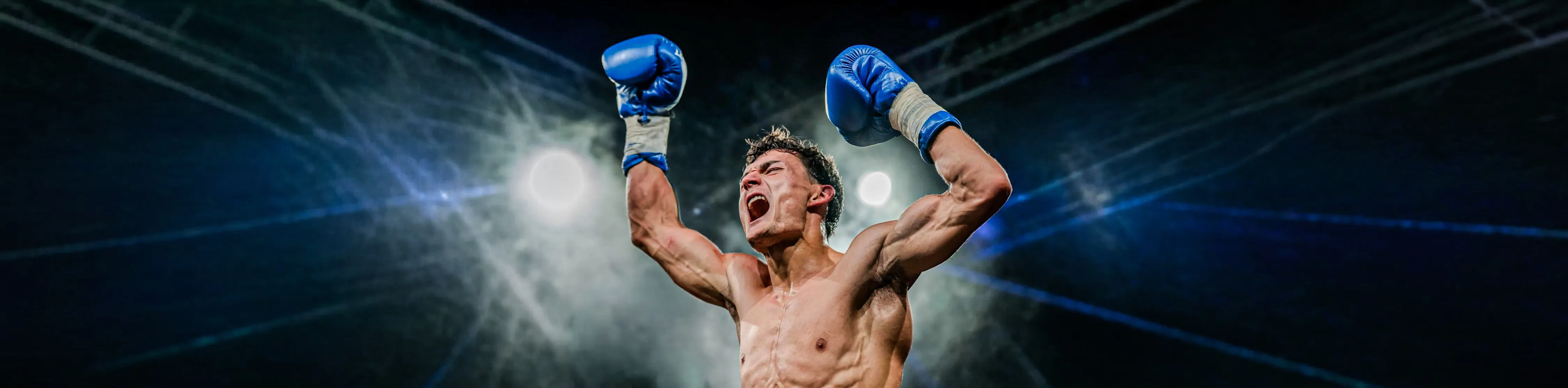 Anto screaming with both gloves raised after winning a fight